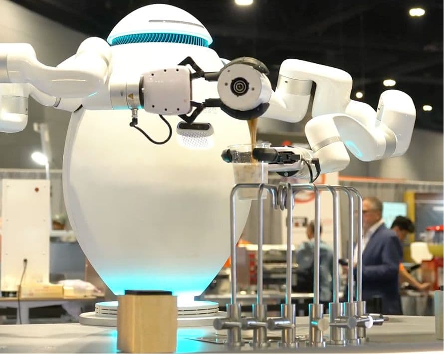 adam the robot making a coffee