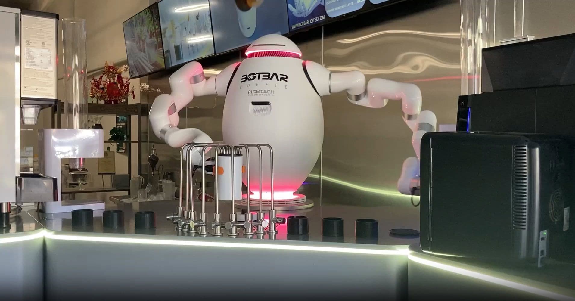 adam the barista robot in a coffee store