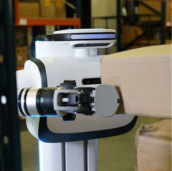 dex placing a box on a shelf